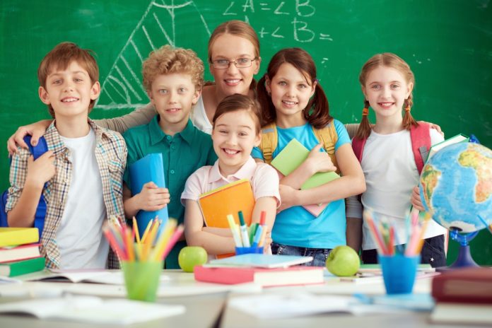 proud-teacher-with-her-elementary-students